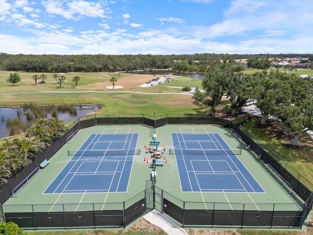 857 Macaw Cir, Venice, FL 34285 - view of tennis court featuring golf course view, a water view, and fence
