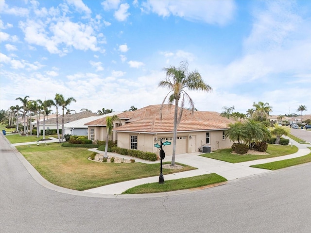 857 Macaw Cir, Venice, FL 34285 - ranch-style home with an attached garage, stucco siding, concrete driveway, central air condition unit, and a front yard