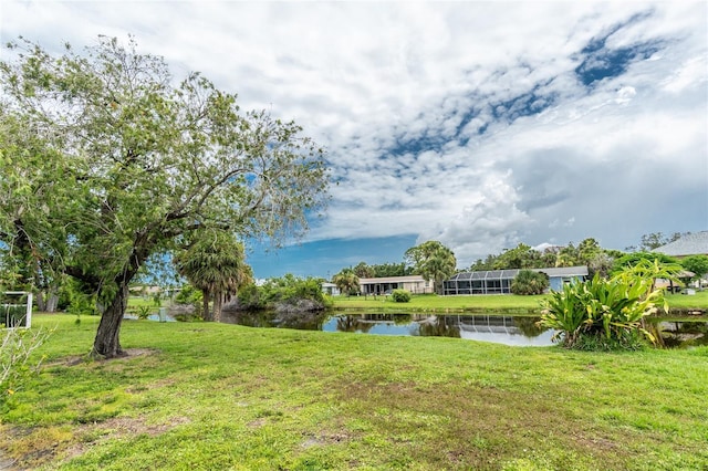261 Caddy Rd, Rotonda West, FL 33947 - view of grassy yard featuring a water view