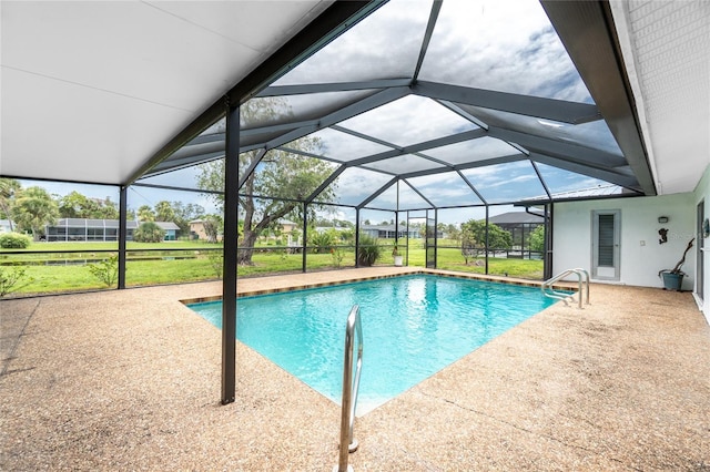261 Caddy Rd, Rotonda West, FL 33947 - swimming pool with a patio area, glass enclosure, and a lawn