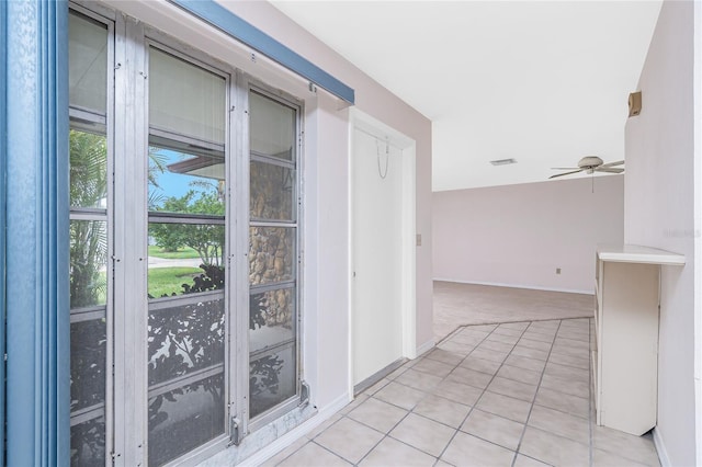 261 Caddy Rd, Rotonda West, FL 33947 - hallway with light tile patterned floors and light carpet