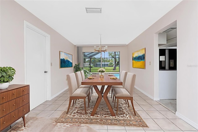 261 Caddy Rd, Rotonda West, FL 33947 - dining area with light tile patterned flooring and a chandelier