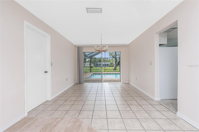 261 Caddy Rd, Rotonda West, FL 33947 - spare room featuring a chandelier and light tile patterned flooring
