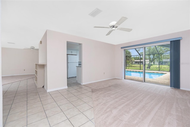 261 Caddy Rd, Rotonda West, FL 33947 - spare room featuring a ceiling fan, light colored carpet, and a sunroom