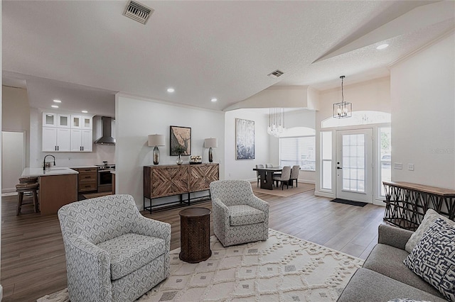 1711 Boca Raton Ct, Punta Gorda, FL 33950 - living area with recessed lighting, a notable chandelier, light wood-style flooring, and visible vents