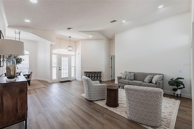 1711 Boca Raton Ct, Punta Gorda, FL 33950 - living room featuring crown molding, visible vents, a textured ceiling, and wood finished floors