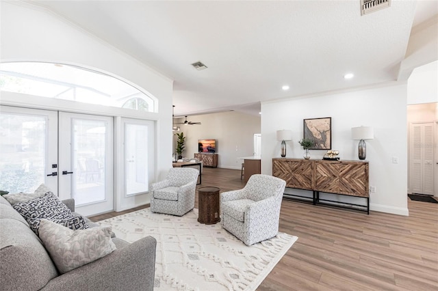 1711 Boca Raton Ct, Punta Gorda, FL 33950 - living area featuring ornamental molding, french doors, visible vents, and light wood-style floors