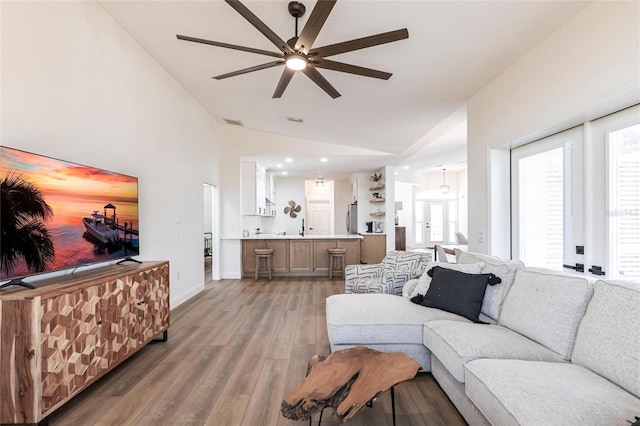 1711 Boca Raton Ct, Punta Gorda, FL 33950 - living room with visible vents, baseboards, ceiling fan, light wood-style floors, and vaulted ceiling
