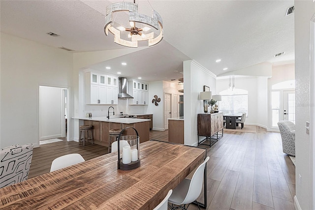 1711 Boca Raton Ct, Punta Gorda, FL 33950 - dining room featuring a notable chandelier, baseboards, visible vents, and wood finished floors