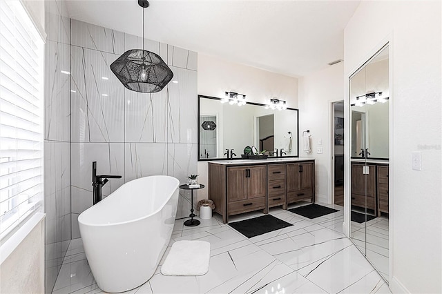 1711 Boca Raton Ct, Punta Gorda, FL 33950 - full bath featuring walk in shower, a freestanding bath, tile walls, and vanity