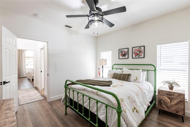 1711 Boca Raton Ct, Punta Gorda, FL 33950 - bedroom featuring wood finished floors, baseboards, visible vents, and multiple windows