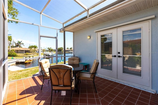 1711 Boca Raton Ct, Punta Gorda, FL 33950 - sunroom / solarium with a water view, french doors, and outdoor dining space