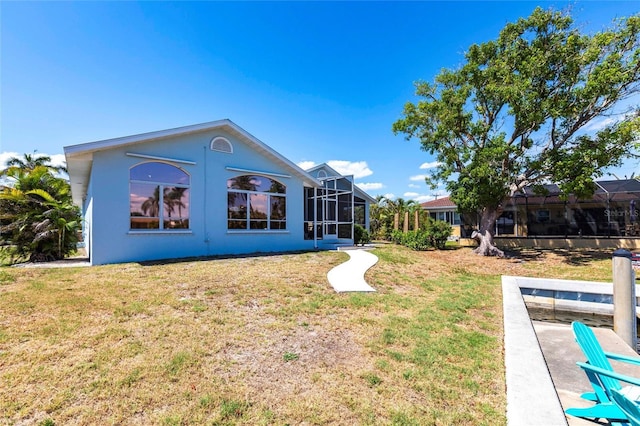 1711 Boca Raton Ct, Punta Gorda, FL 33950 - back of house featuring a yard and stucco siding