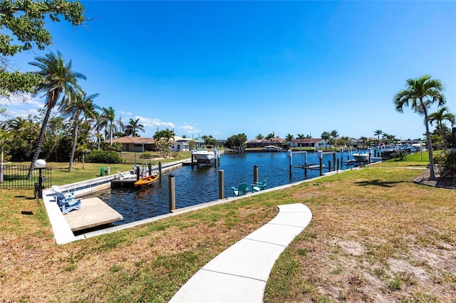 1711 Boca Raton Ct, Punta Gorda, FL 33950 - view of dock featuring a lawn and a water view