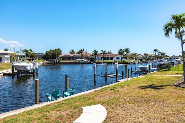 1711 Boca Raton Ct, Punta Gorda, FL 33950 - view of dock featuring boat lift, a yard, a water view, and a residential view