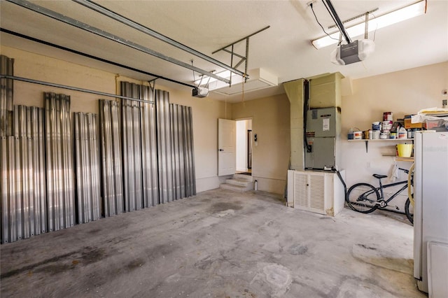 1711 Boca Raton Ct, Punta Gorda, FL 33950 - garage featuring freestanding refrigerator, heating unit, and a garage door opener