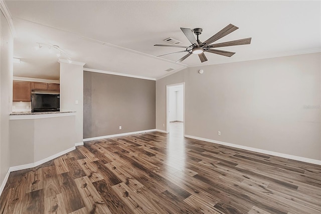 unfurnished living room featuring visible vents, ornamental molding, wood finished floors, baseboards, and ceiling fan