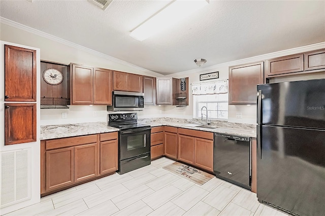 kitchen featuring a sink, ornamental molding, vaulted ceiling, and black appliances