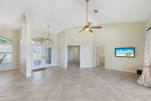interior space featuring high vaulted ceiling, french doors, a ceiling fan, light tile patterned floors, and visible vents