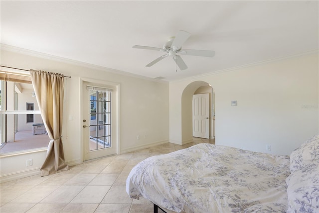 bedroom featuring ceiling fan, arched walkways, baseboards, light tile patterned floors, and ornamental molding