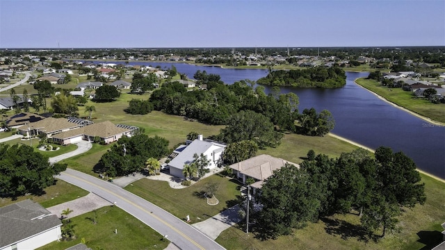 drone / aerial view featuring a water view and a residential view
