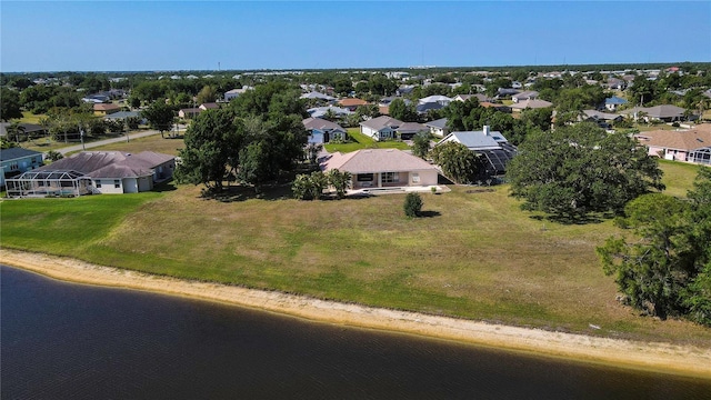 birds eye view of property featuring a residential view and a water view