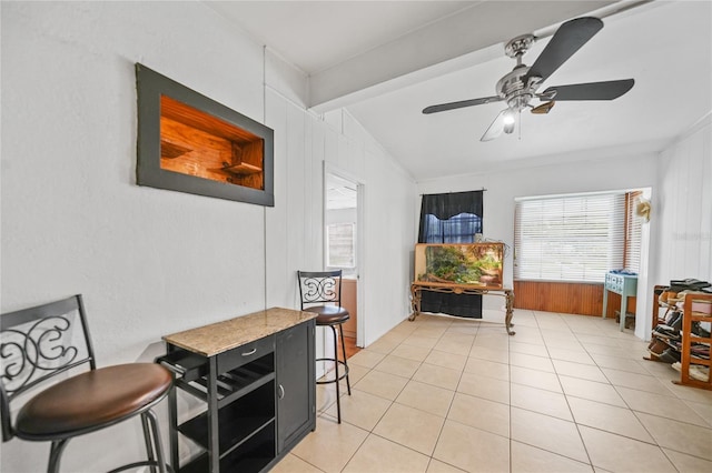 2321 Dallas St, Port Charlotte, FL 33952 - living area with plenty of natural light, light tile patterned floors, vaulted ceiling with beams, and ceiling fan
