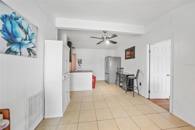 2321 Dallas St, Port Charlotte, FL 33952 - kitchen with visible vents, freestanding refrigerator, beamed ceiling, ceiling fan, and light tile patterned floors