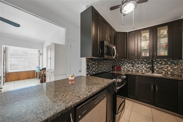 2321 Dallas St, Port Charlotte, FL 33952 - kitchen with ceiling fan, a sink, stainless steel appliances, light tile patterned floors, and tasteful backsplash