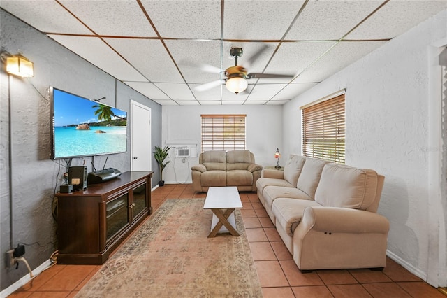 2321 Dallas St, Port Charlotte, FL 33952 - tiled living room featuring baseboards, a ceiling fan, a paneled ceiling, and a textured wall