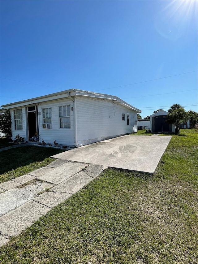 2321 Dallas St, Port Charlotte, FL 33952 - view of side of home featuring a lawn