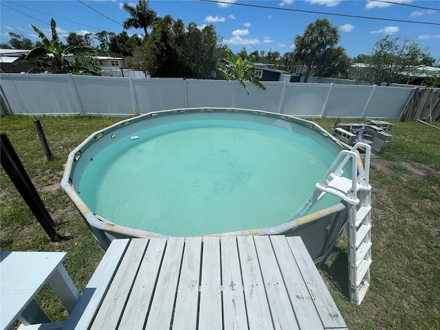2321 Dallas St, Port Charlotte, FL 33952 - view of swimming pool with a lawn, a fenced backyard, and a fenced in pool