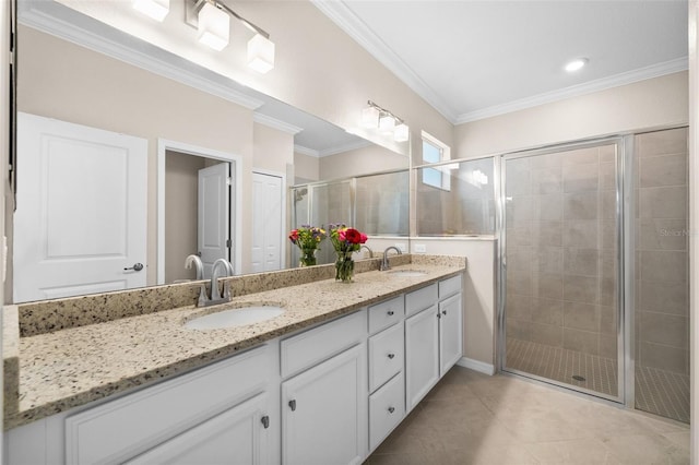 bathroom with a sink, tile patterned floors, a stall shower, and double vanity