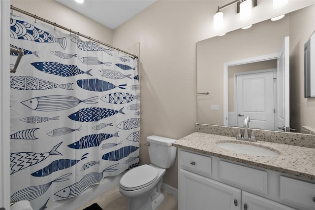 bathroom with toilet, a shower with shower curtain, and vanity