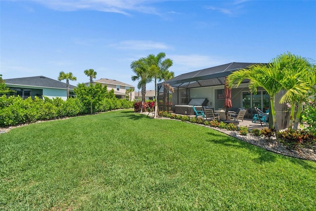 view of yard featuring a patio and a lanai