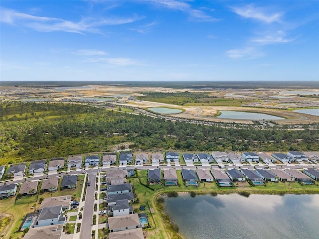 birds eye view of property with a residential view and a water view