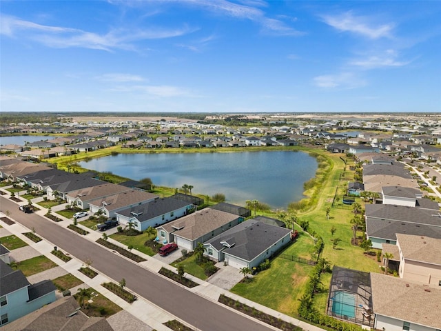 aerial view featuring a residential view and a water view