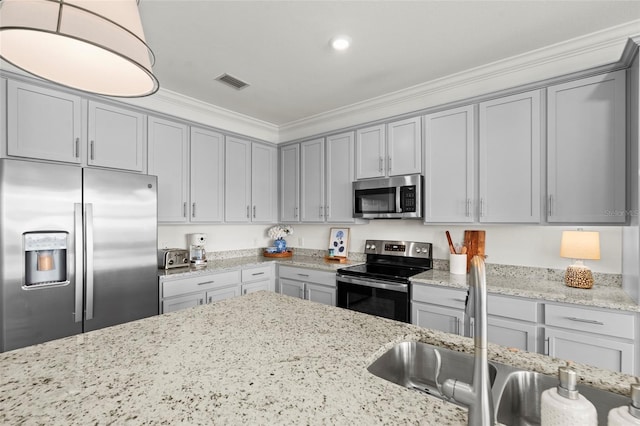 14061 Heritage Landing Blvd Unit 445, Punta Gorda, FL 33955 - kitchen featuring a sink, gray cabinets, stainless steel appliances, visible vents, and ornamental molding