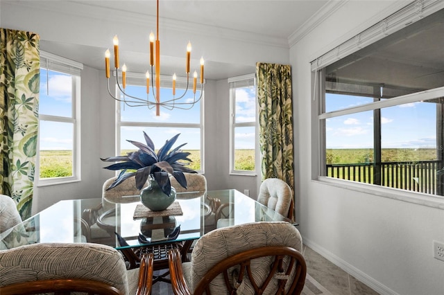 14061 Heritage Landing Blvd Unit 445, Punta Gorda, FL 33955 - dining area with baseboards, a notable chandelier, and ornamental molding