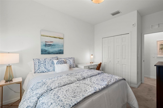 14061 Heritage Landing Blvd Unit 445, Punta Gorda, FL 33955 - bedroom featuring baseboards, visible vents, a closet, and light colored carpet
