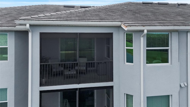 14061 Heritage Landing Blvd Unit 445, Punta Gorda, FL 33955 - view of side of home featuring stucco siding and a tiled roof