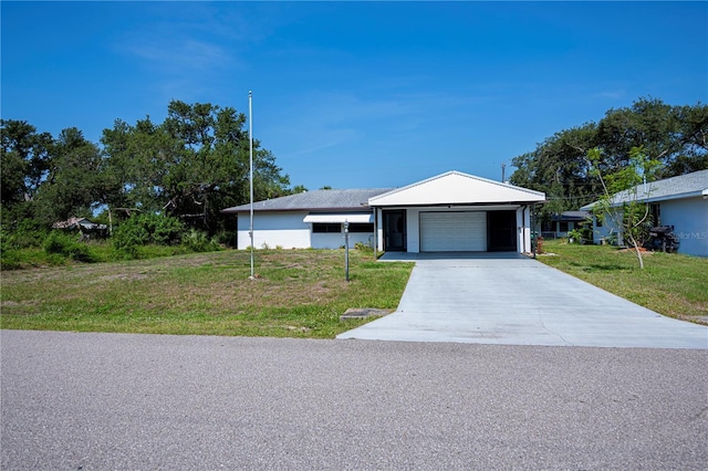 2113 Barksdale St, Port Charlotte, FL 33948 - single story home with a front yard, driveway, and an attached garage
