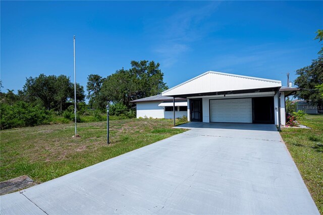 2113 Barksdale St, Port Charlotte, FL 33948 - single story home featuring a front lawn, an attached garage, and driveway