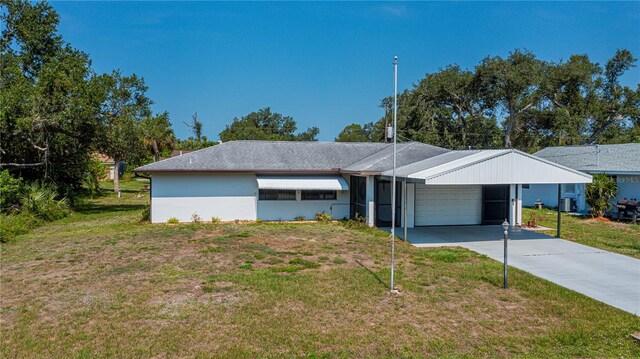 2113 Barksdale St, Port Charlotte, FL 33948 - ranch-style home featuring a garage, a front yard, concrete driveway, and a carport