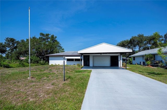 2113 Barksdale St, Port Charlotte, FL 33948 - ranch-style house with a front lawn, a garage, central AC unit, and driveway