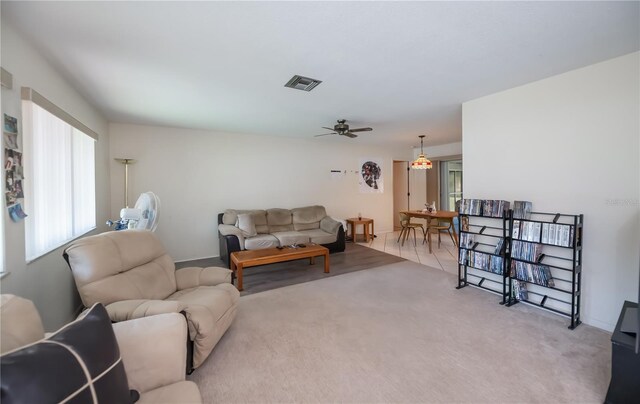 2113 Barksdale St, Port Charlotte, FL 33948 - living area featuring ceiling fan, light carpet, and baseboards