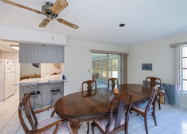 2113 Barksdale St, Port Charlotte, FL 33948 - dining area with light tile patterned floors and ceiling fan