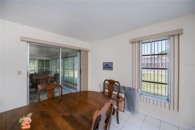 2113 Barksdale St, Port Charlotte, FL 33948 - dining room with light tile patterned floors and healthy amount of natural light