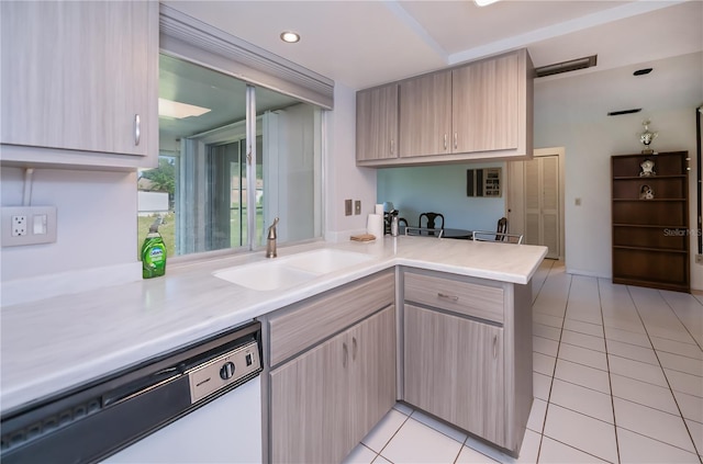 2113 Barksdale St, Port Charlotte, FL 33948 - kitchen featuring dishwasher, light tile patterned flooring, a sink, and light countertops