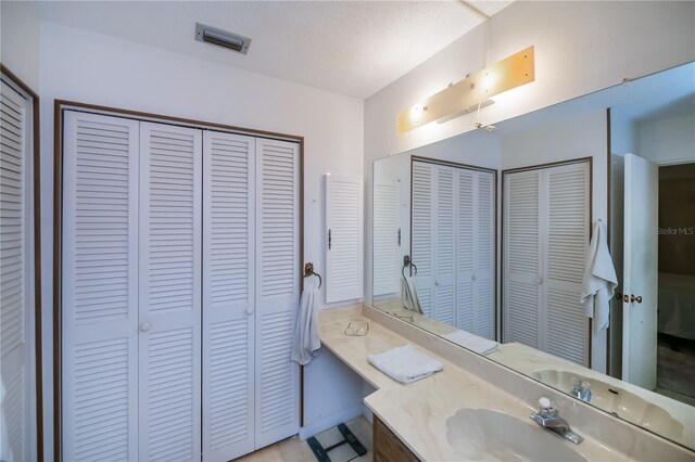 2113 Barksdale St, Port Charlotte, FL 33948 - bathroom with a closet and vanity